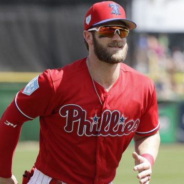 Bryce Harper with glasses running on the field