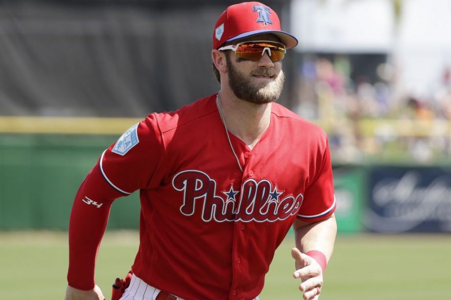 Bryce Harper with glasses running on the field